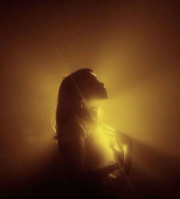 Silhouette glowing in golden light